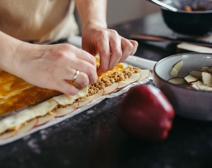 Organic farmer Sissy is making apple roses with puff pastry and Red Delicious apples