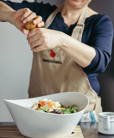 Organic farmer Sissy is dressing the apple salad